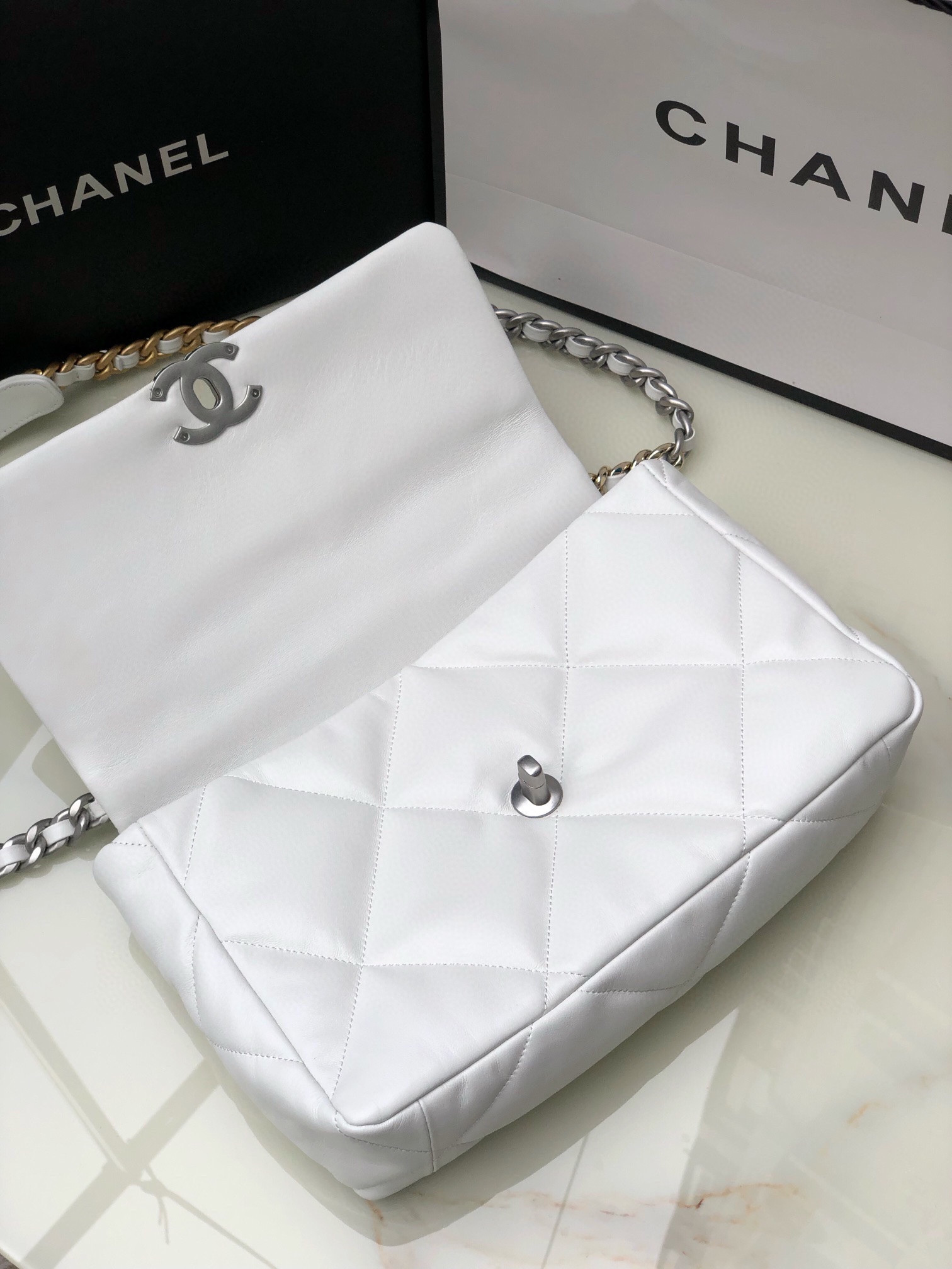 CHANEL 19 LARGE HANDBAG Shiny Leather, Gold-Tone, Silver-Tone & Ruthenium-Finish Metal White 7.8 × 11.7 × 3.9 in