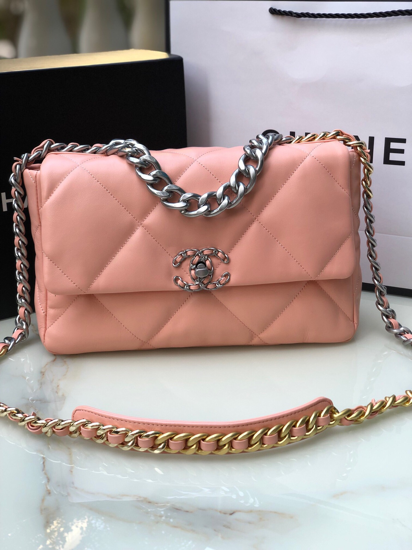 CHANEL 19 LARGE HANDBAG Shiny Leather, Gold-Tone, Silver-Tone & Ruthenium-Finish Metal Light Pink 7.8 × 11.7 × 3.9 in