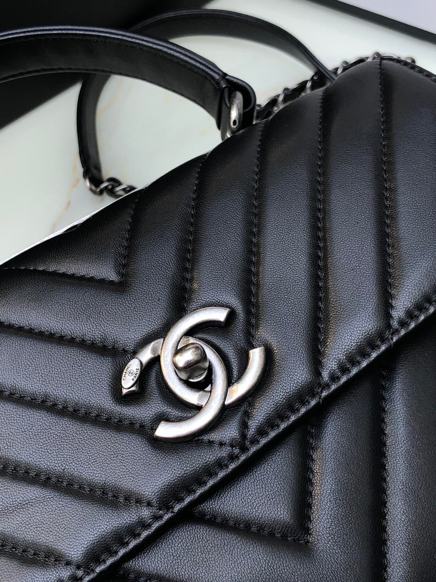 Ch*el flap bag with top handle 6.6 × 9.8 × 4.7 in
